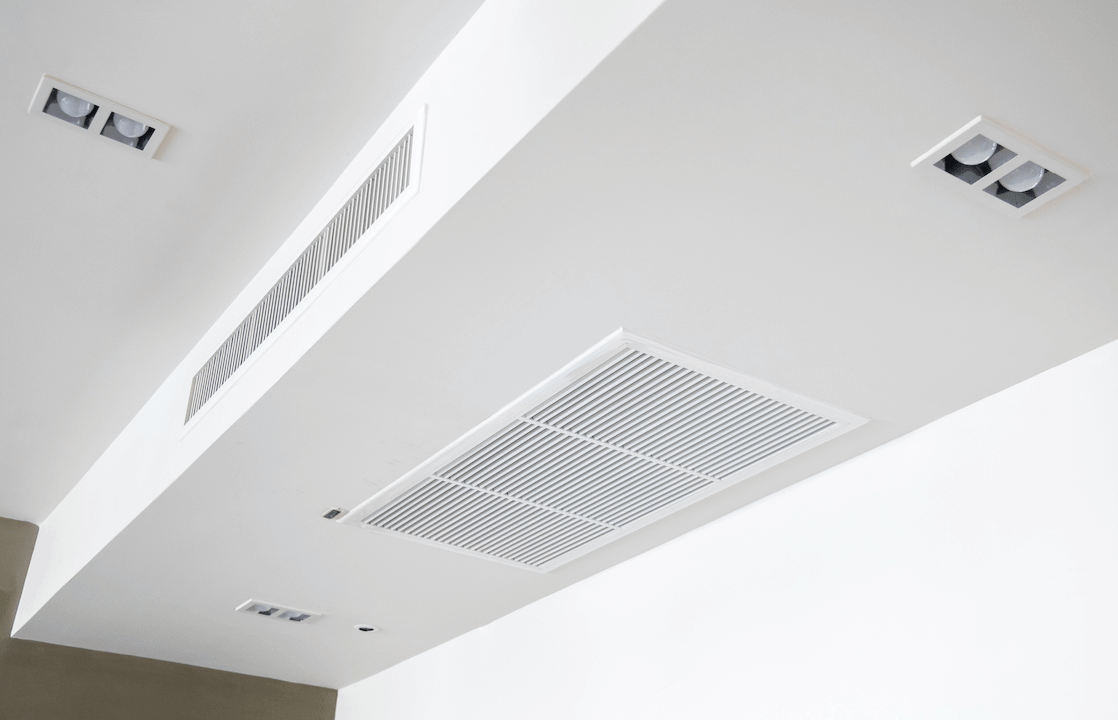 Ducted air conditioning vents installed in the ceiling for efficient cooling and heating in residential and commercial spaces.