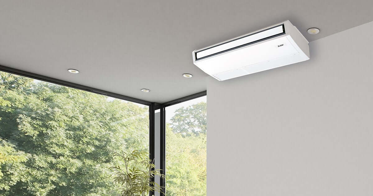 One-way ceiling-mounted air conditioning unit in modern room with large windows and natural light. Ideal for targeted cooling and heating.